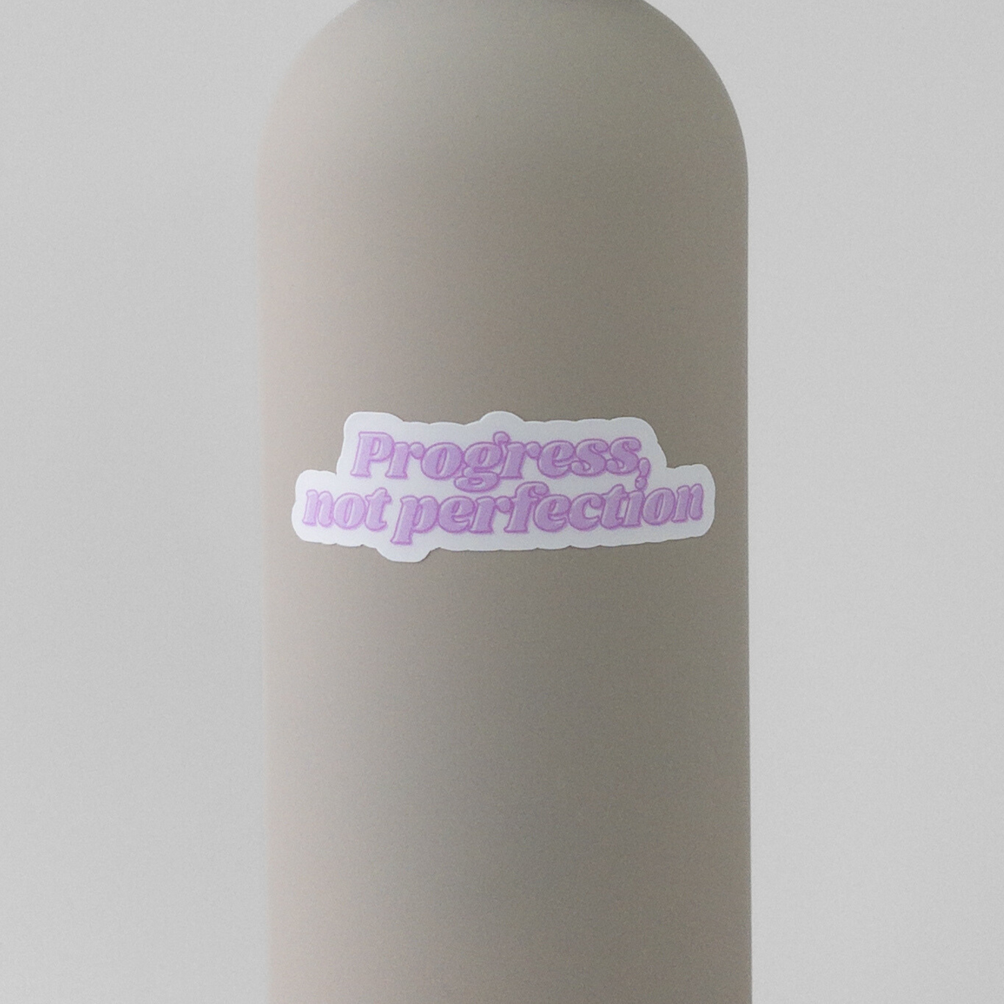 Pink sticker for grad students to remember progress not perfection