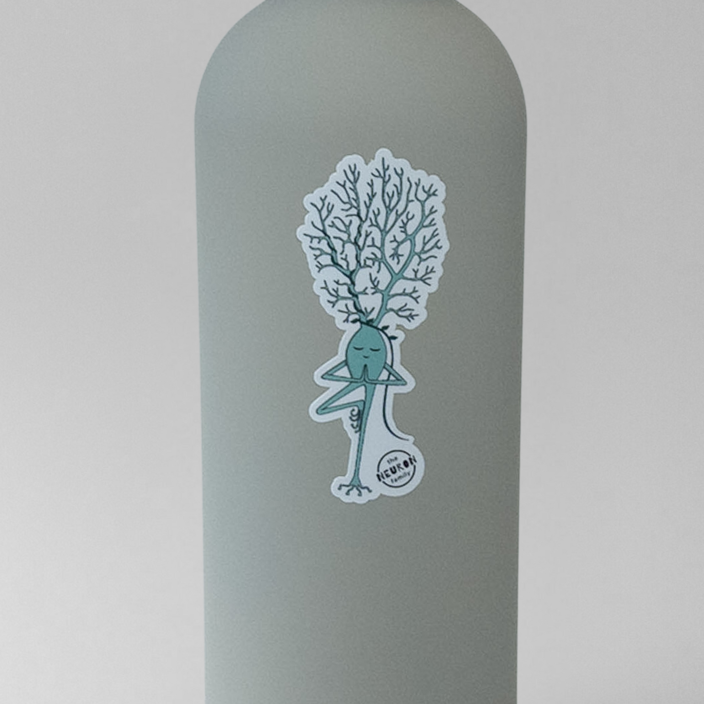 Gray water bottle with yoga neuron sticker on a light gray background